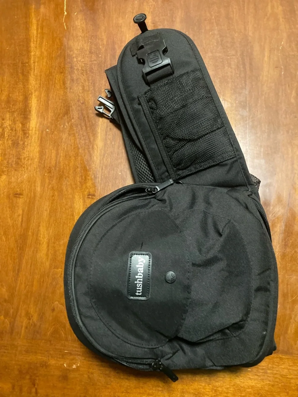 tushbaby Black Baby Sling Bag with Multiple Storage Pockets